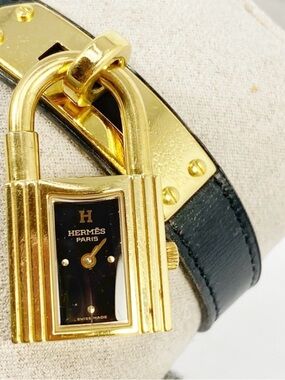 Hermès Gold and Black Padlock Leather Bracelet Watch